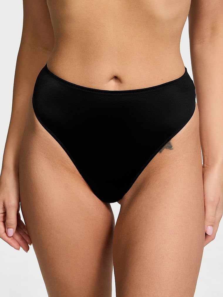 Stringi z wysokim stanem i paseczkami z tyłu Strappy-Back. Produkt ma kolor czarny i pochodzi z kolekcji Very Sexy. 