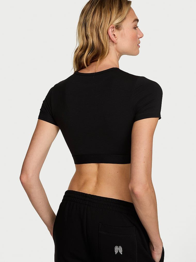 Crop top bawełniany braletka z krótkimi rękawami Shine Patch. Produkt ma kolor czarny i pochodzi z kolekcji T-shirt. 