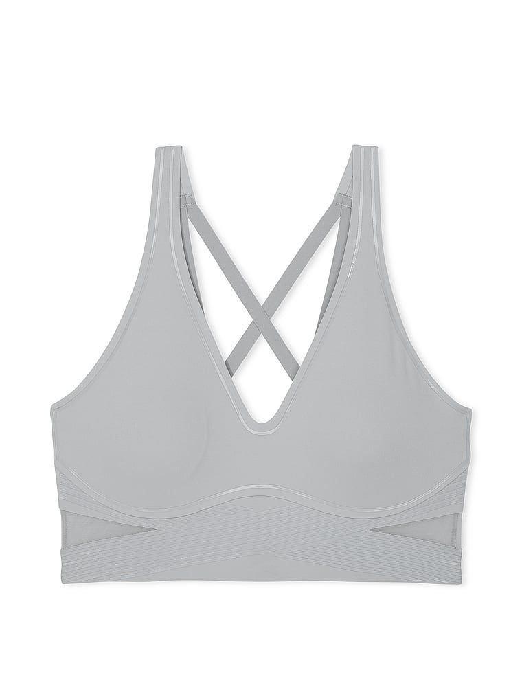 Na zdjęciu na białym tle widoczny jest biustonosz sportowy z lekkim wsparciem i dekoltem VSX Elevate Refined Contours. Produkt ma kolor szary i pochodzi z kolekcji VSX.
