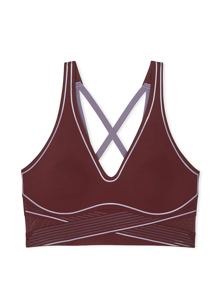 Na zdjęciu na białym tle widoczny jest biustonosz sportowy z lekkim wsparciem i dekoltem VSX Elevate Refined Contours. Produkt ma kolor czerwony i pochodzi z kolekcji VSX.