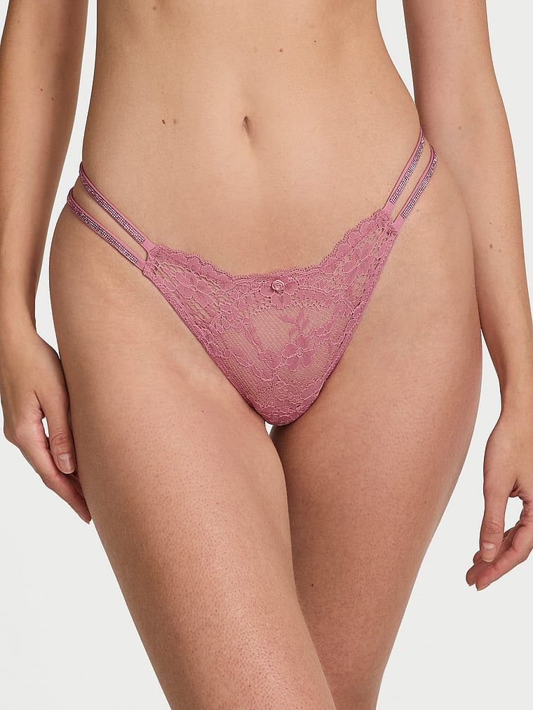Majtki brazyliany koronkowe z błyszczącymi paseczkami Twinkle Strap Brazilian. Produkt ma kolor różowy i pochodzi z kolekcji Dream Angels. 
