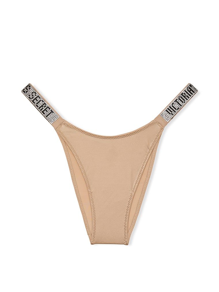 Majtki brazyliany z błyszczącymi paskami Shine Strap Brazilian. Produkt ma kolor beżowy i pochodzi z kolekcji Very Sexy. 