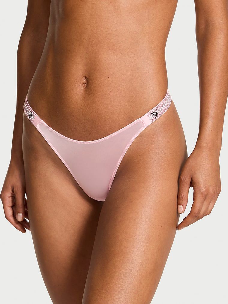 Stringi z błyszczącymi paskami Shine Strap. Produkt ma kolor różowy i pochodzi z kolekcji Very Sexy. 