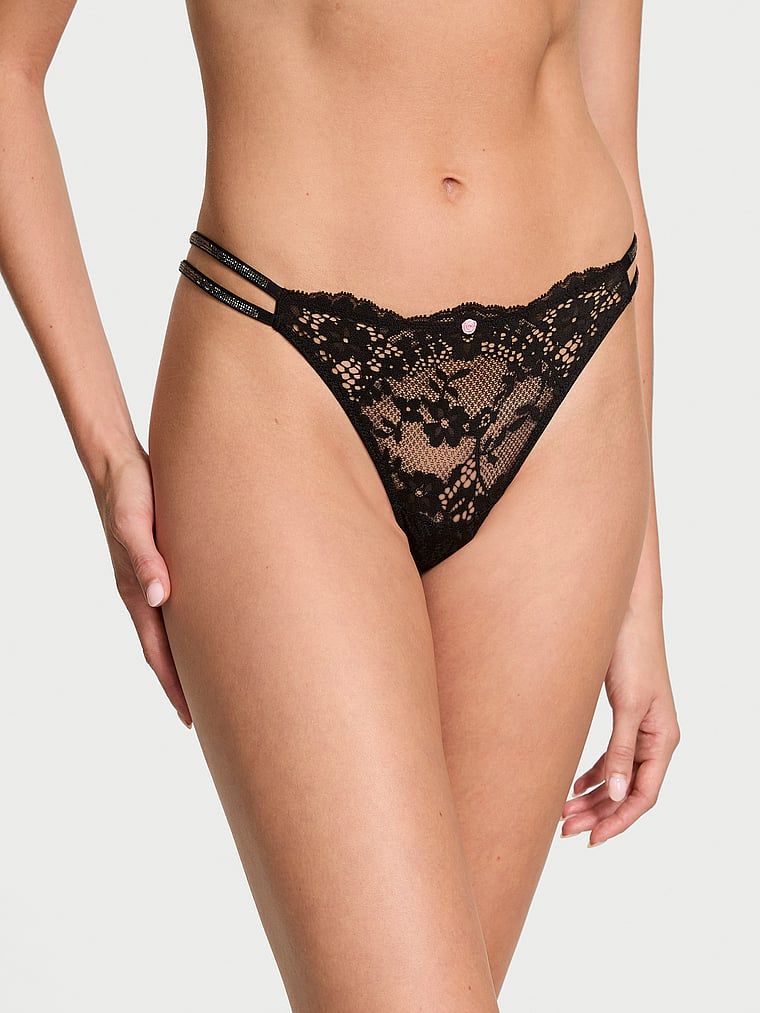 Majtki brazyliany koronkowe z błyszczącymi paseczkami Twinkle Strap Brazilian. Produkt ma kolor czarny i pochodzi z kolekcji Dream Angels. 
