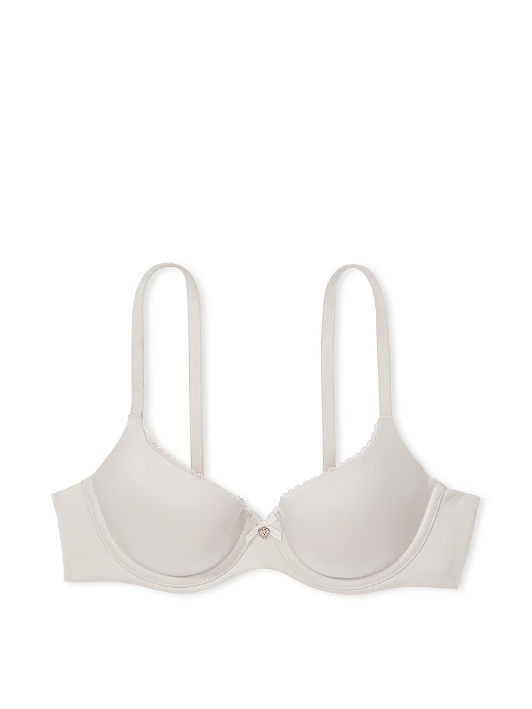 Na zdjęciu na białym tle widoczny jest biustonosz lekko usztywniany Smooth Demi. Produkt ma kolor szary i pochodzi z kolekcji Body by Victoria.
