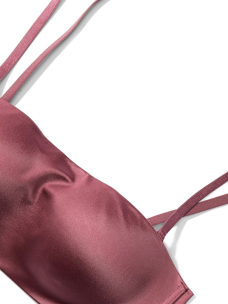 Biustonosz push-up bez ramiączek i bez fiszbin Bandeau. Produkt ma kolor różowy i pochodzi z kolekcji Invisible by Victoria's Secret. 