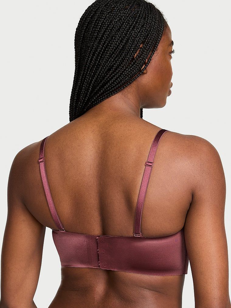 Biustonosz push-up bez ramiączek i bez fiszbin Bandeau. Produkt ma kolor różowy i pochodzi z kolekcji Invisible by Victoria's Secret. 