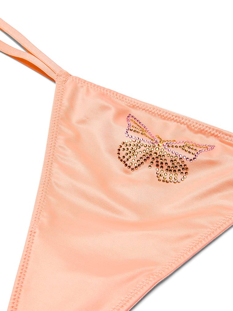 Stringi satynowe Twinkle Butterfly. Produkt ma kolor beżowy i pochodzi z kolekcji Dream Angels. 