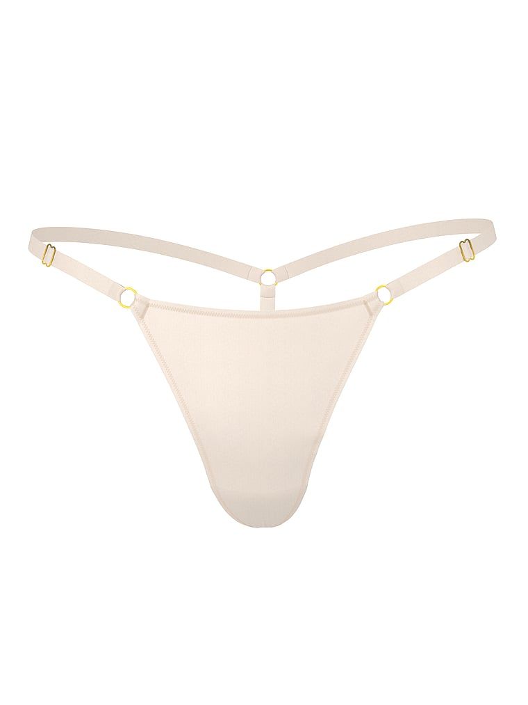 Stringi z regulowanymi paseczkami Hardware. Produkt ma kolor beżowy i pochodzi z kolekcji Body by Victoria. 