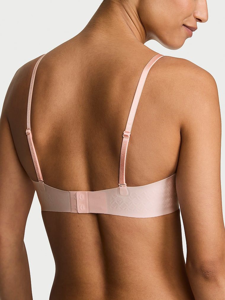 Biustonosz push-up bez ramiączek Uplift Strapless. Produkt ma kolor różowy i pochodzi z kolekcji Victoria's Secret Bare. 