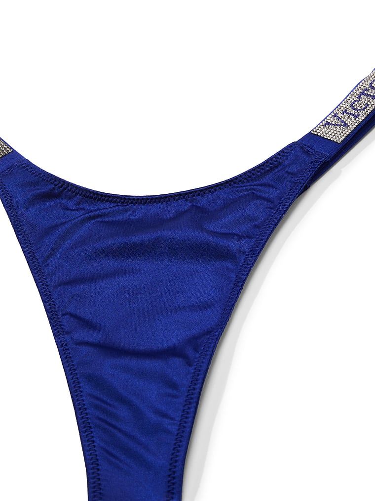 Stringi z błyszczącymi paskami Shine Strap. Produkt ma kolor niebieski i pochodzi z kolekcji Very Sexy. 