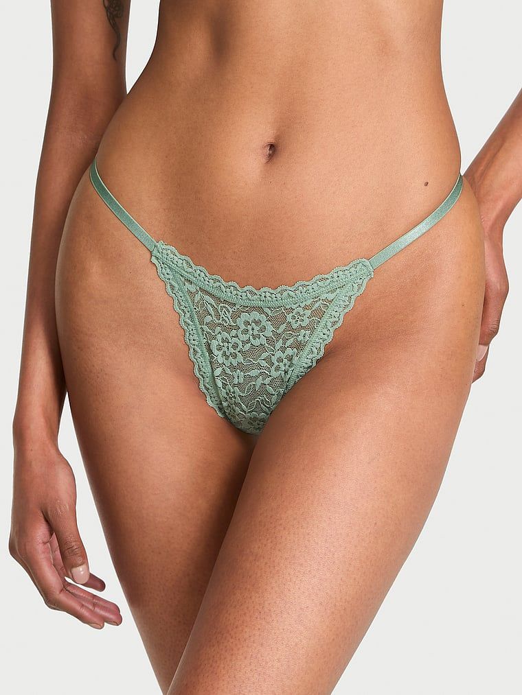 Stringi koronkowe z paseczkami z tyłu Blossom. Produkt ma kolor zielony i pochodzi z kolekcji Lacie. 
