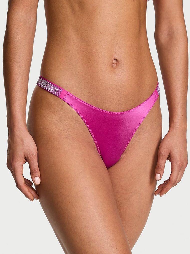 Stringi z błyszczącymi paskami Shine Strap. Produkt ma kolor różowy i pochodzi z kolekcji Very Sexy. 