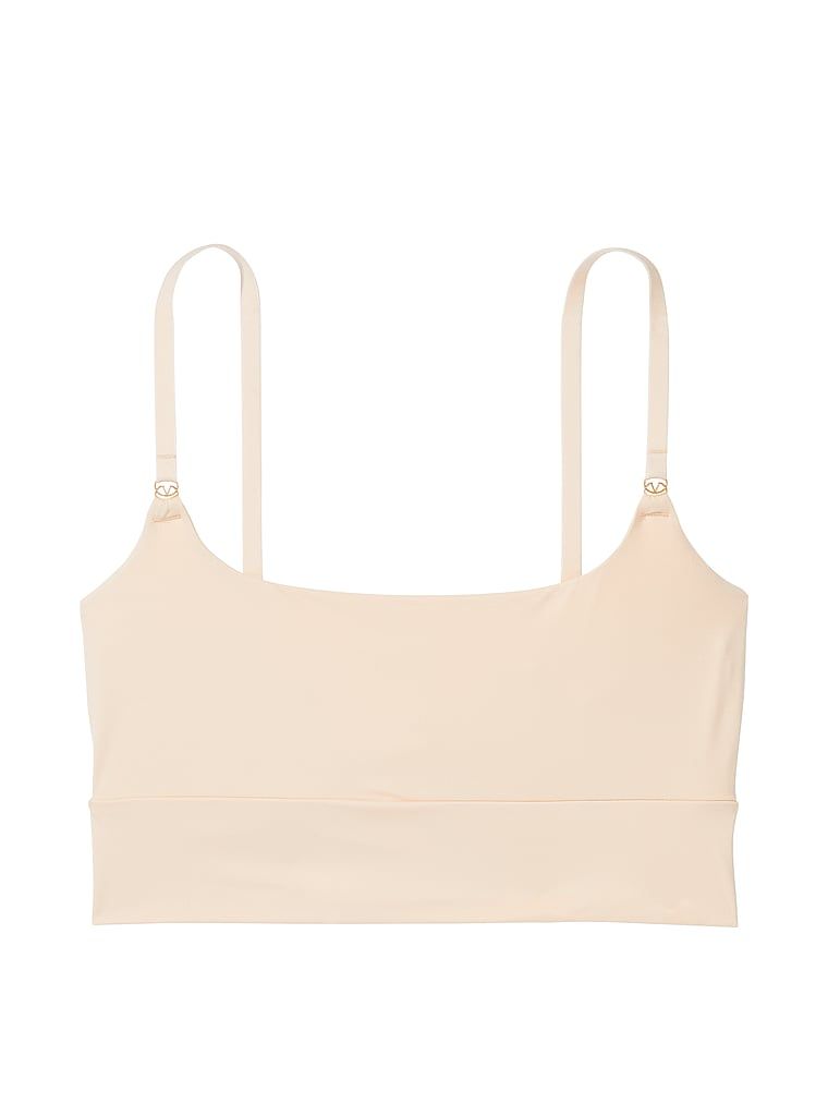 Na zdjęciu na białym tle widoczny jest biustonosz braletka Feathersoft Essentials. Produkt ma kolor beżowy i pochodzi z kolekcji Victoria's Secret.