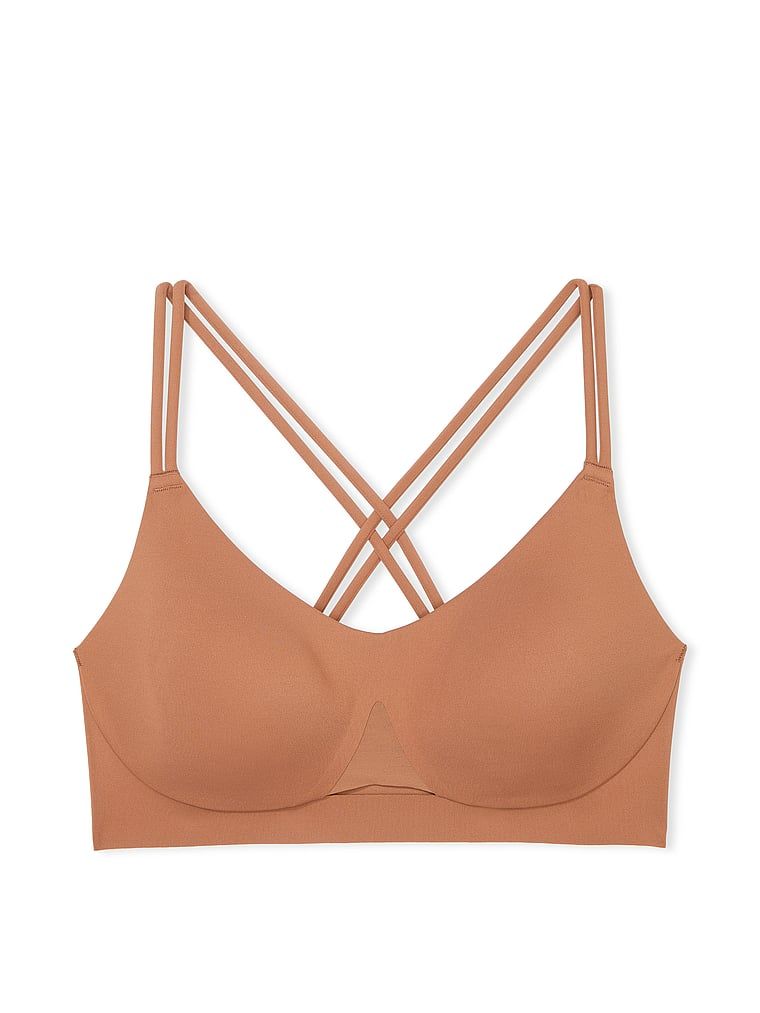 Na zdjęciu na białym tle widoczny jest biustonosz sportowy z lekkim wsparciem Elevate Strappy. Produkt ma kolor brązowy i pochodzi z kolekcji VSX.