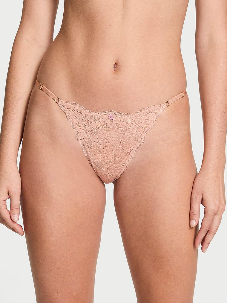 Majtki koronkowe z regulowanymi paskami Bikini. Produkt ma kolor beżowy i pochodzi z kolekcji Dream Angels. 