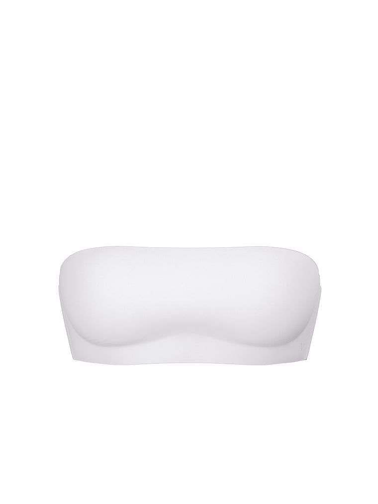 Modelka prezentuje biustonosz push-up bez ramiączek i bez fiszbin Perfect Comfort Strapless. Produkt ma kolor biały i pochodzi z kolekcji Victoria's Secret Bare.