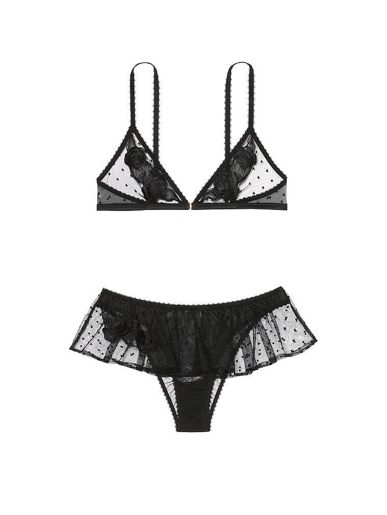Na zdjęciu na białym tle widoczny jest zestaw z siateczki - biustonosz braletka i majtki z falbanką Sheer Rose Dot. Produkt jest wzorzysty i pochodzi z kolekcji Victoria's Secret.