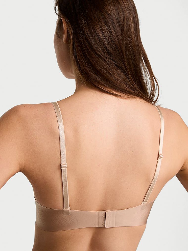 Biustonosz lekko usztywniany bez ramiączek Strapless. Produkt ma kolor beżowy i pochodzi z kolekcji Invisible by Victoria's Secret. 