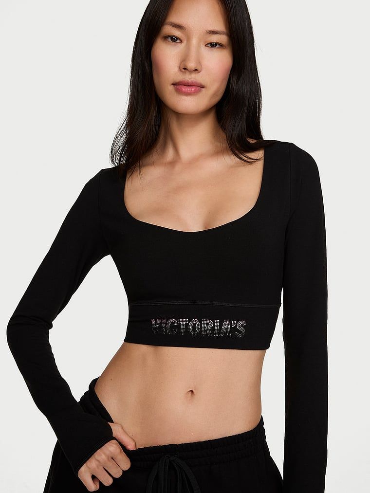 Crop top z długimi rękawami bawełniany. Produkt ma kolor czarny i pochodzi z kolekcji Angel Essentials. 