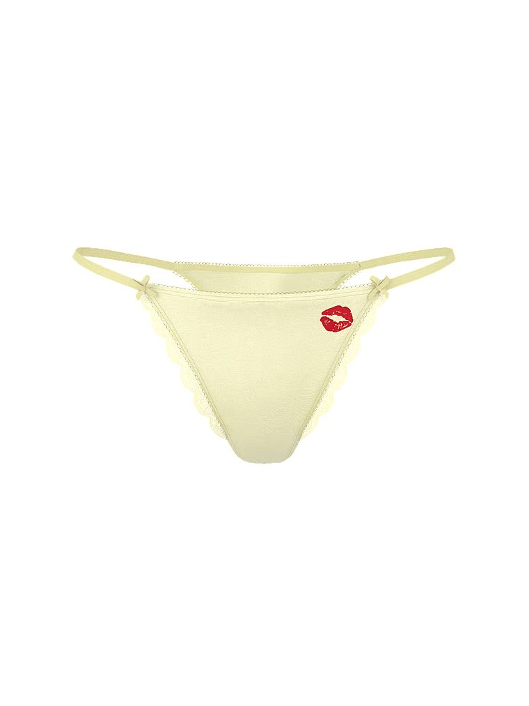 Stringi satynowe z wysoko wyciętymi nogawkami Tease Kiss. Produkt ma kolor żółty i pochodzi z kolekcji Victoria's Secret. 