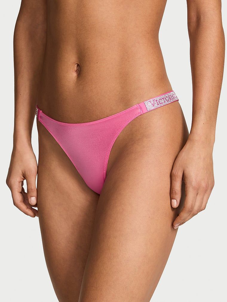 Majtki brazyliany z błyszczącymi paskami Shine Strap Brazilian. Produkt ma kolor różowy i pochodzi z kolekcji Very Sexy. 