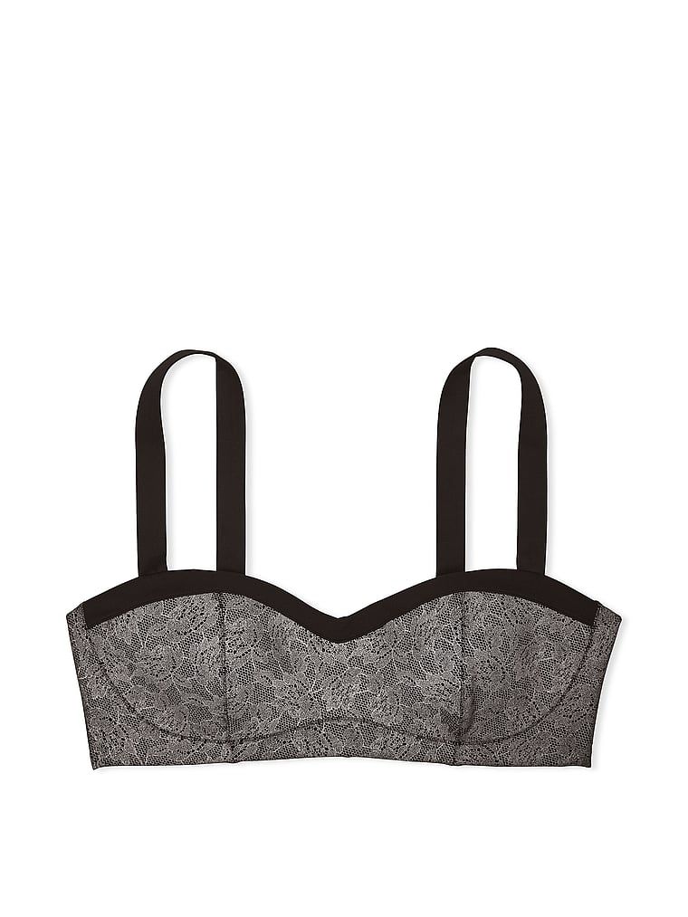 Na zdjęciu na białym tle widoczny jest biustonosz sportowy z lekkim wsparciem VSX Glow Reflective Lace. Produkt jest wzorzysty i pochodzi z kolekcji VSX.