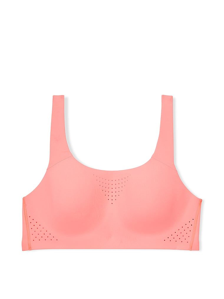 Na zdjęciu na białym tle widoczny jest biustonosz sportowy z maksymalnym podtrzymaniem Featherweight Max. Produkt ma kolor czerwony i pochodzi z kolekcji VSX.