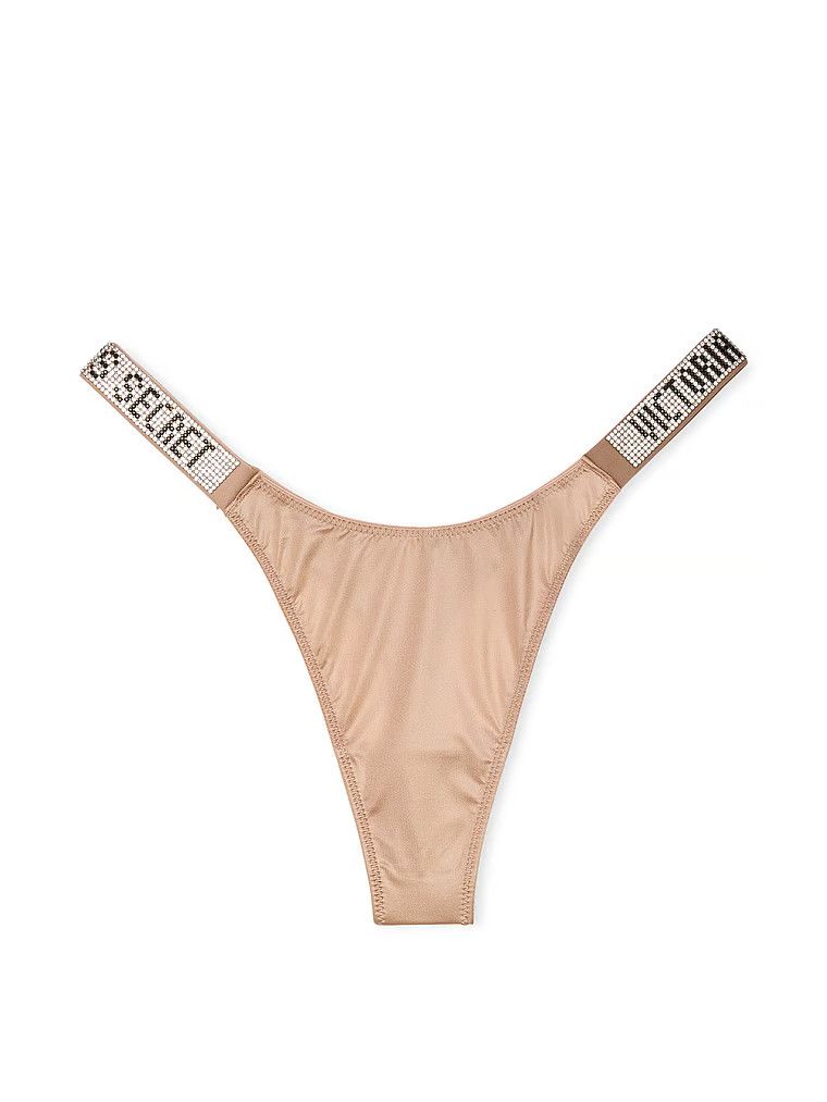 Stringi z błyszczącymi paskami Shine Strap. Produkt ma kolor beżowy i pochodzi z kolekcji Very Sexy. 