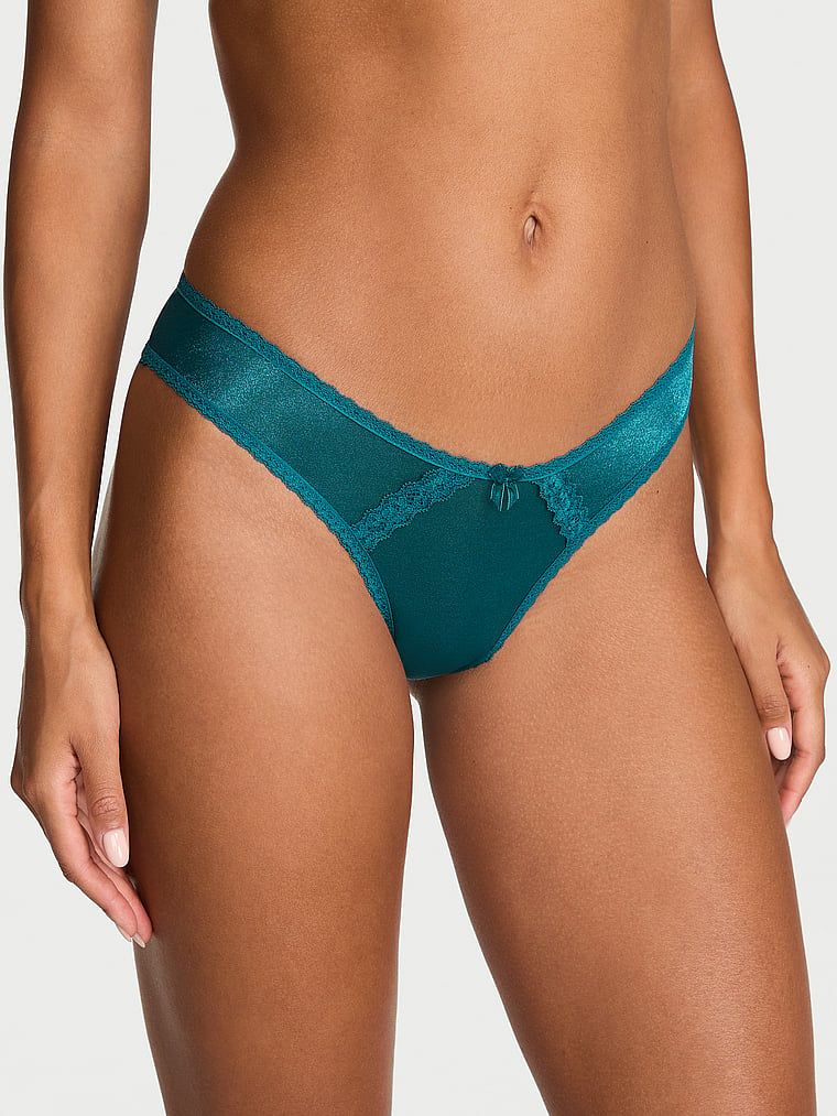 Majtki błyszczące brazyliany z wycięciami z tyłu Sheer Shimmer Brazilian. Produkt ma kolor niebieski i pochodzi z kolekcji Dream Angels. 