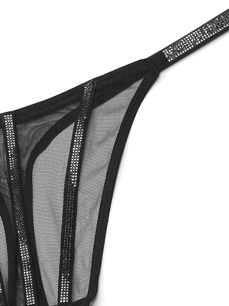 Stringi z błyszczącymi paseczkami Sheer Shine. Produkt ma kolor czarny i pochodzi z kolekcji Very Sexy.
