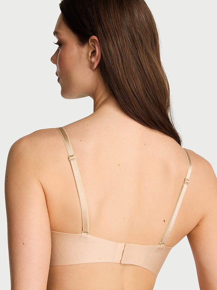 Biustonosz lekko usztywniany bez ramiączek Strapless. Produkt ma kolor beżowy i pochodzi z kolekcji Invisible by Victoria's Secret. 